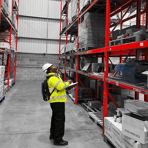 A racking inspection being carried out by an in-house SEMA Approved Racking inspector from Stakapal - Leaders in Innovative Warehouse and Yard Storage Racking Solutions and Cantilever Racking Specialists